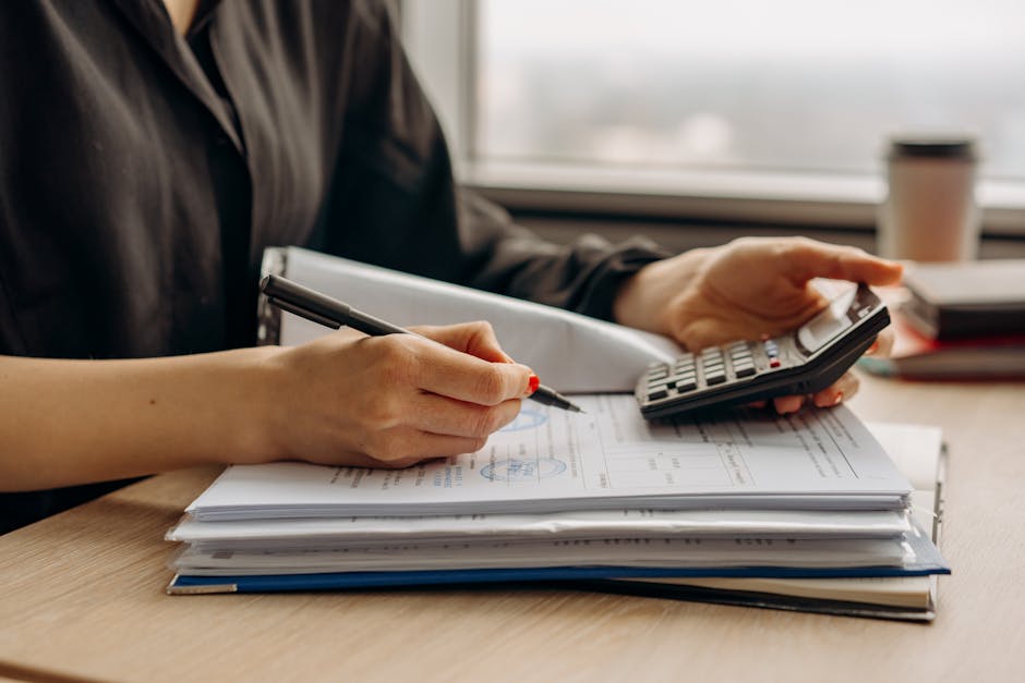 Professional invoice and quote documents laid out on a desk